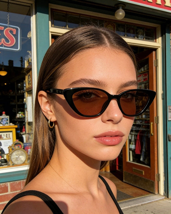 Pink Baby The Juno brown sunglasses with rounded frames and dark tinted lenses, stylish and versatile for everyday wear.