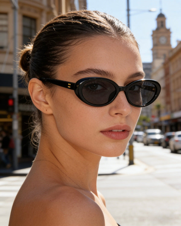 Pink Baby The Kyra black sunglasses with sleek frames and dark lenses, stylish eyewear for sun protection.