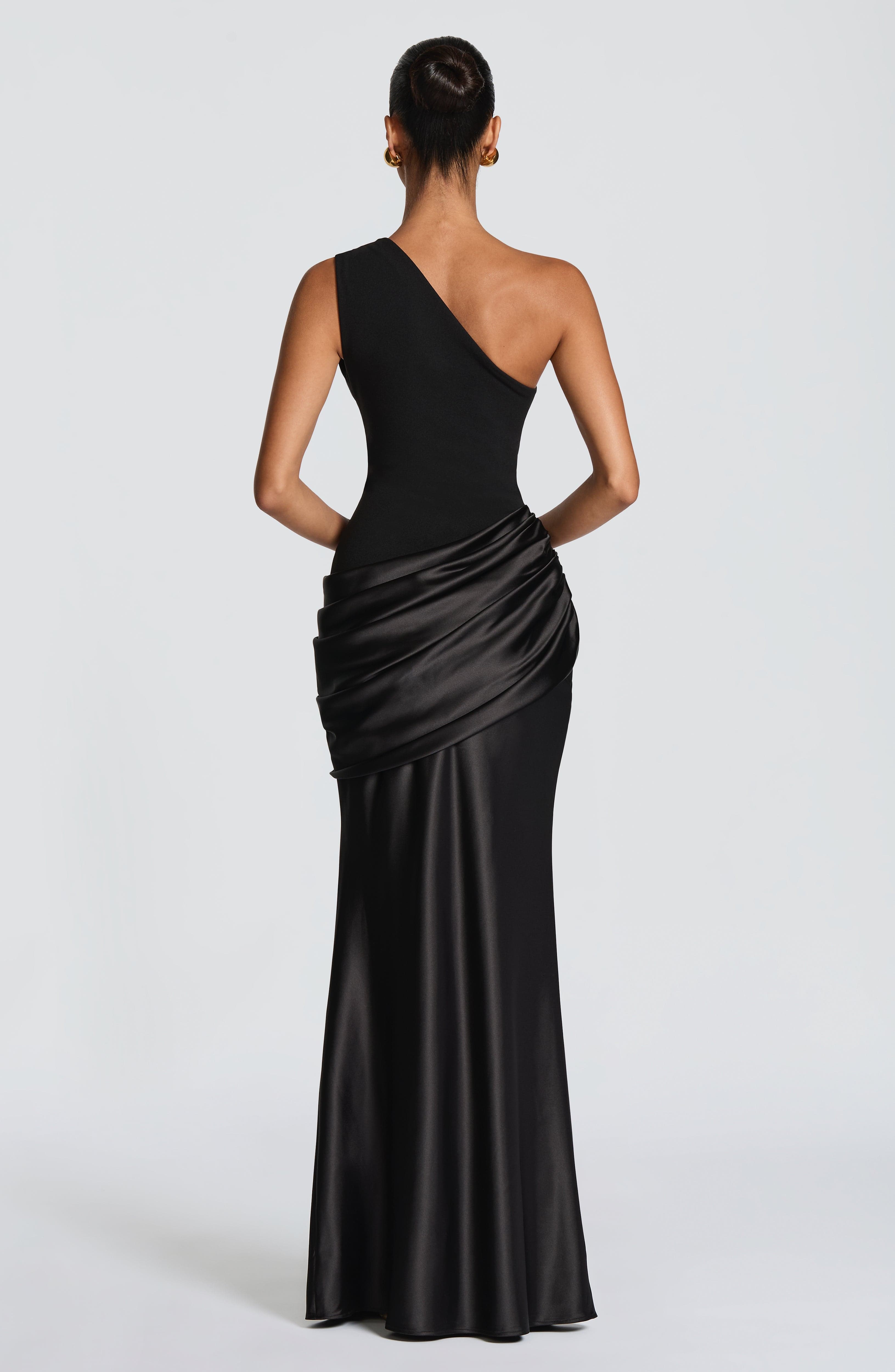 Black Sadona Maxi Dress by Pink Baby featuring a flowing silhouette and elegant design, perfect for stylish occasions.
