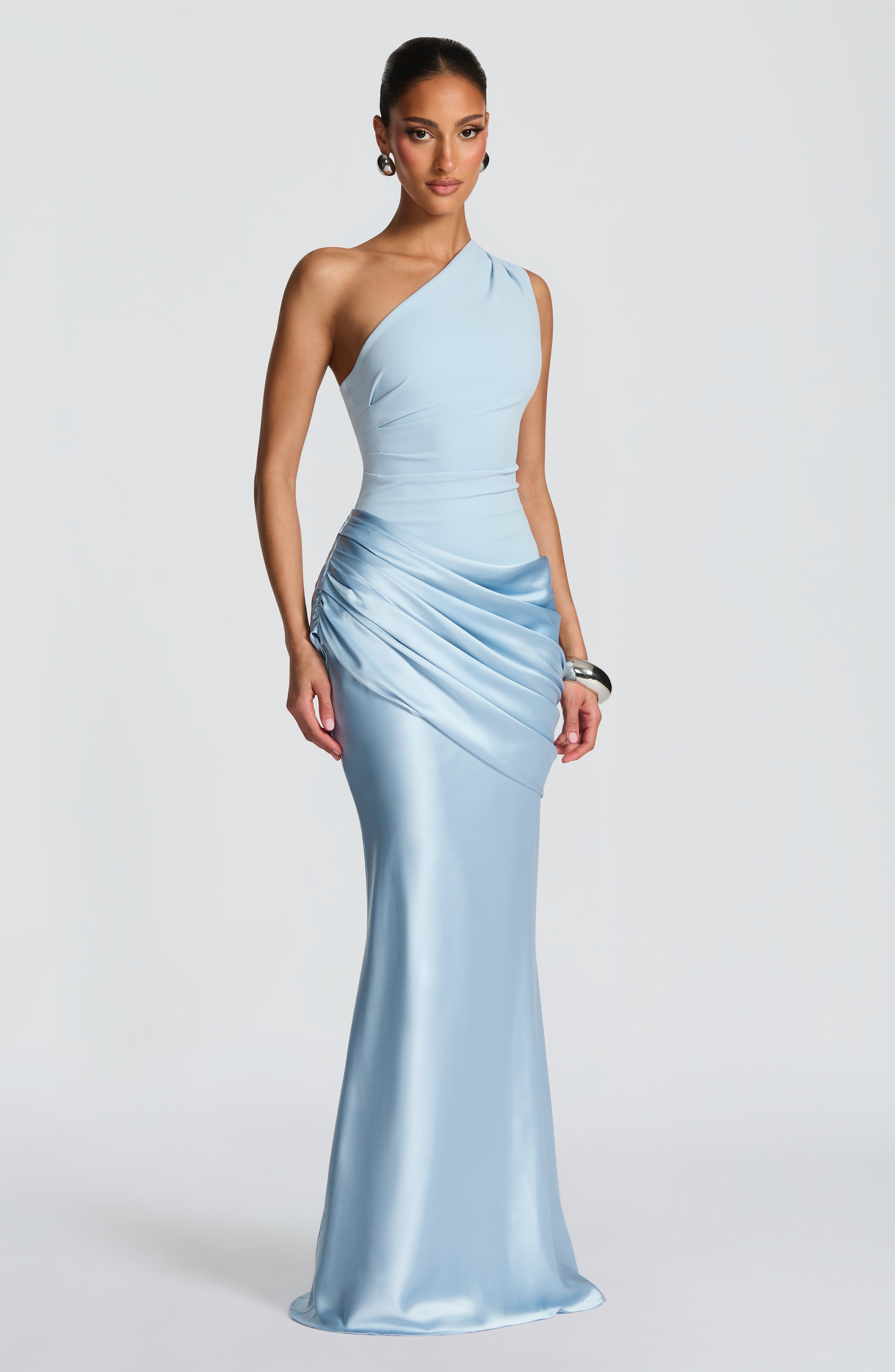 Pink Baby Sadona Maxi Dress in Glacier Blue displayed on a hanger, showcasing flowing fabric and elegant design.