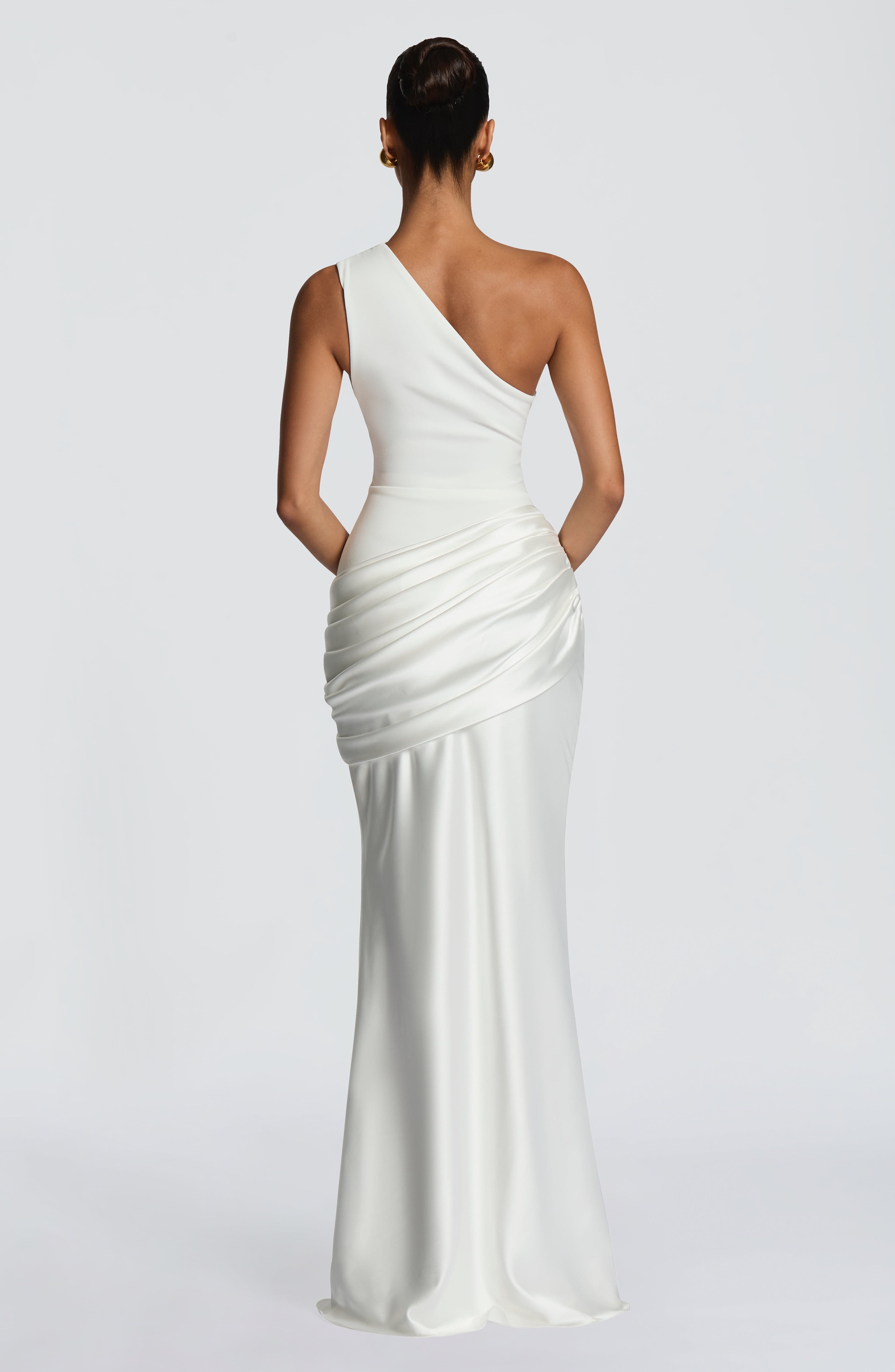 Ivory Sadona Maxi Dress by Pink Baby featuring flowing fabric and elegant design, perfect for formal or casual occasions.