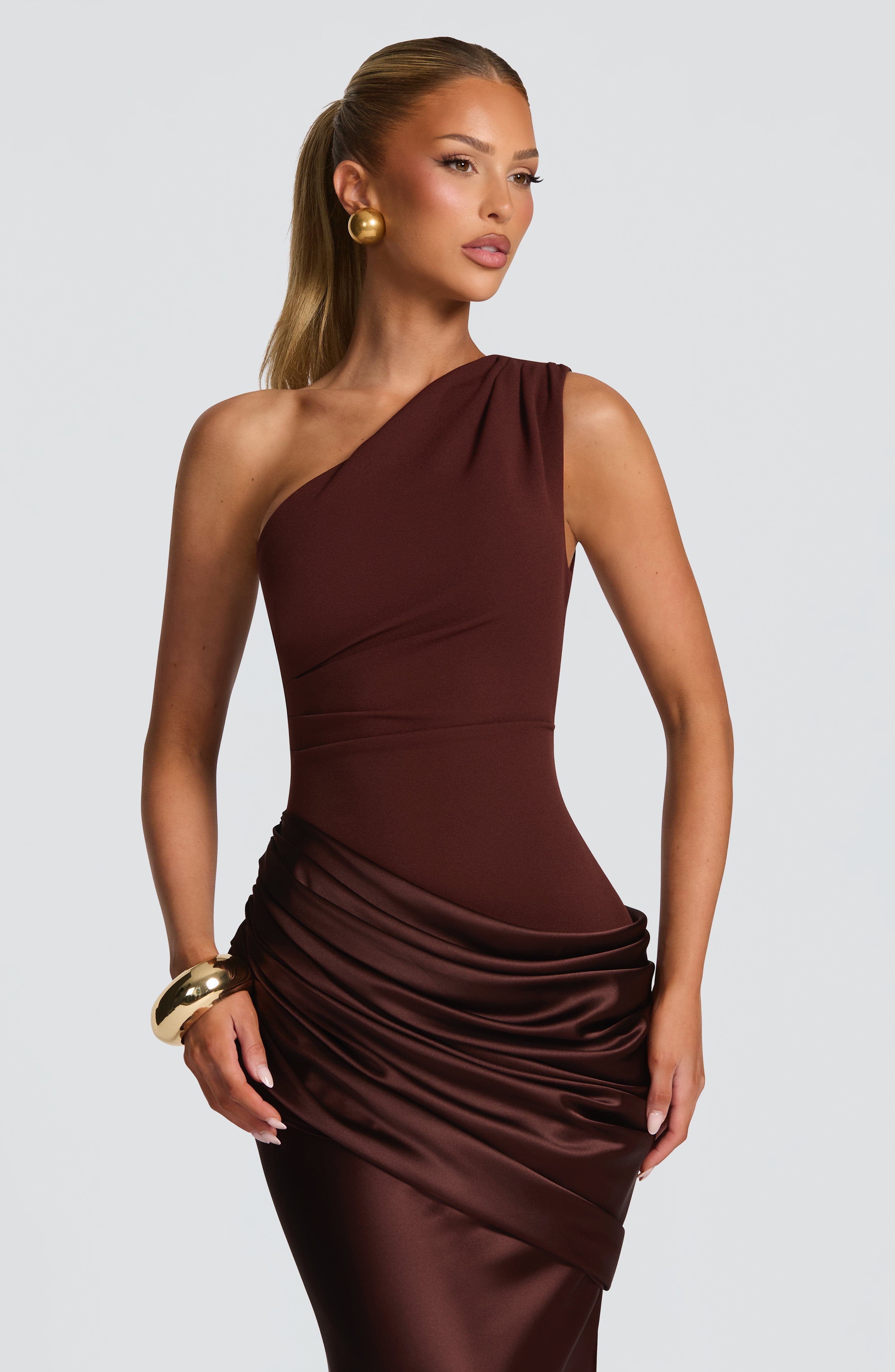 Pink Baby Sadona Maxi Dress in plum brown, flowing fabric with a stylish design, perfect for elegant occasions.