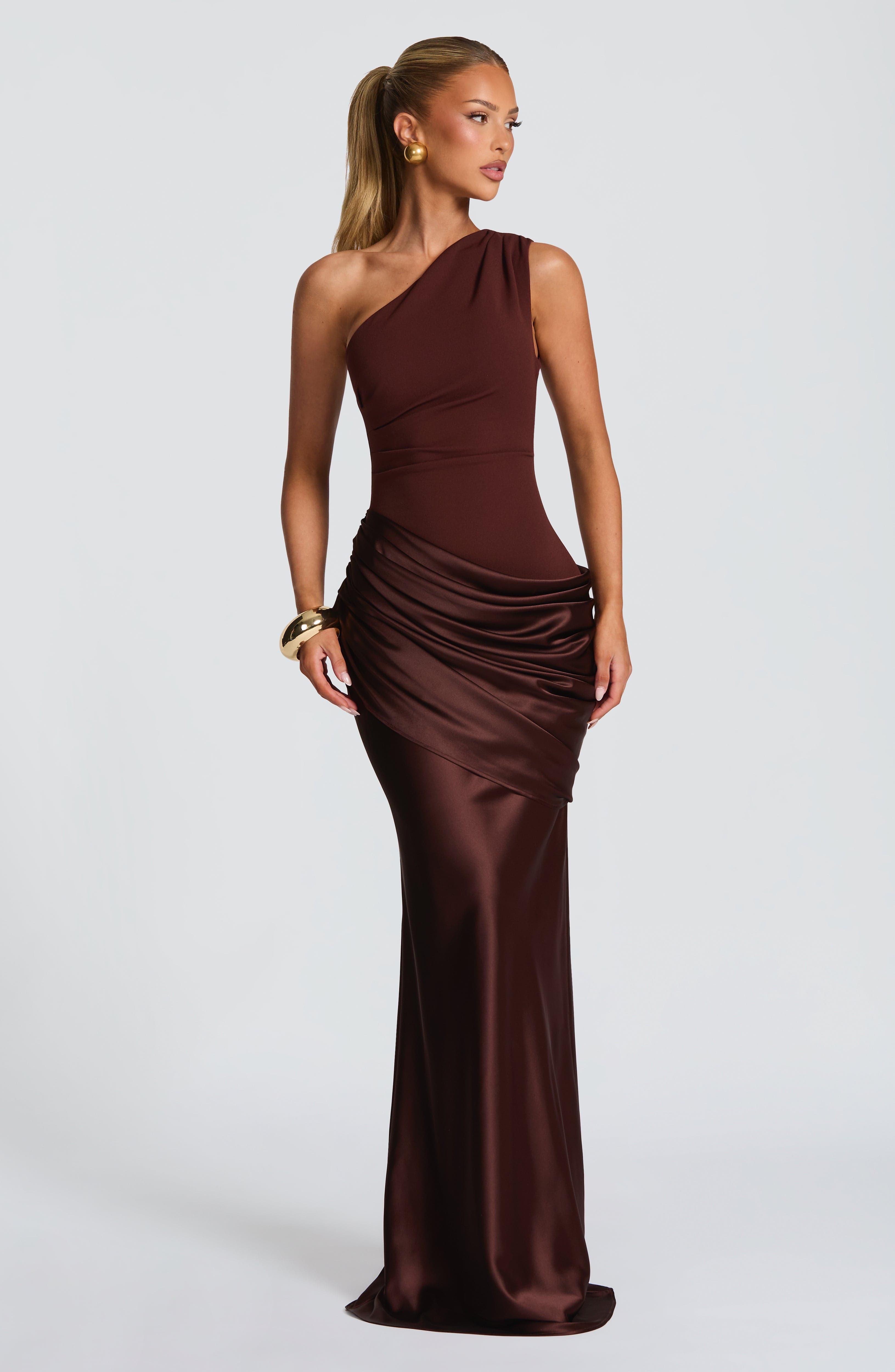 Pink Baby Sadona Maxi Dress in plum brown, flowing fabric with a stylish design, perfect for elegant occasions.