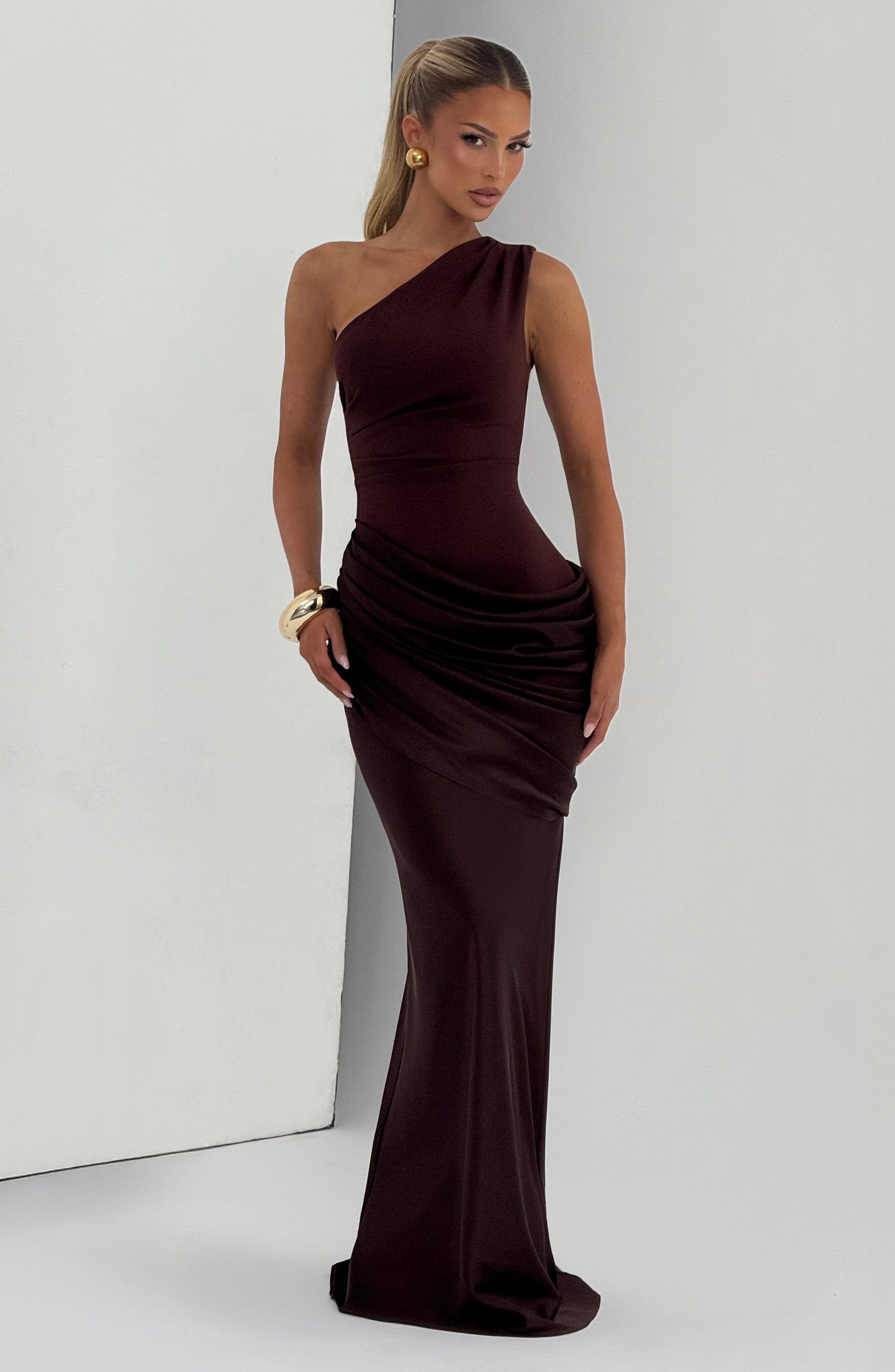 Pink Baby Sadona Maxi Dress in plum brown, featuring flowy fabric and elegant design, perfect for stylish occasions.