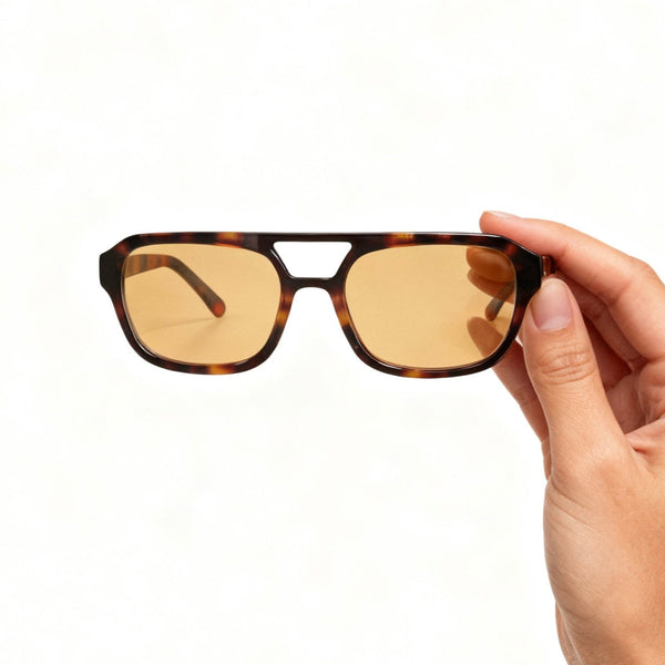 Pink Baby The Kael sunglasses with round tinted lenses and thin metal frames, stylish and trendy eyewear for sunny days.
